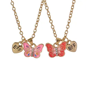 Golden butterfly and heart BFF necklace set for kids with pink and orange enamel charms