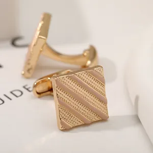Classic men's square gold cufflinks with pink enamel diagonal stripes and matte texture
