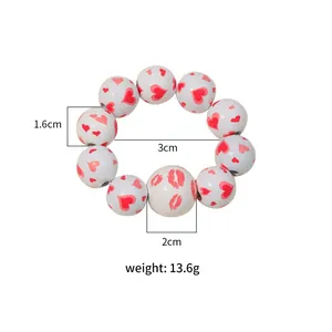 Detailed dimensions of wood bead napkin ring with heart prints and jute tassels