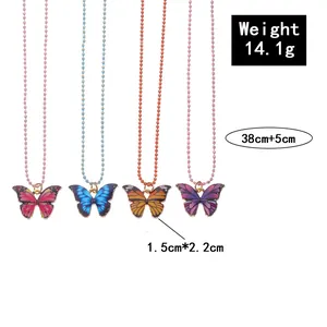 Detail of colorful butterfly necklaces in rose, blue, orange and purple enamel pendant set