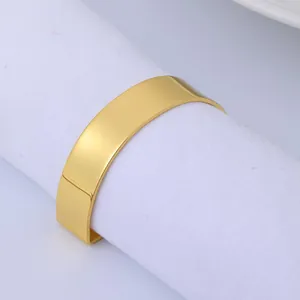 Polished gold semi-circle napkin ring with D-letter design for elegant table setting