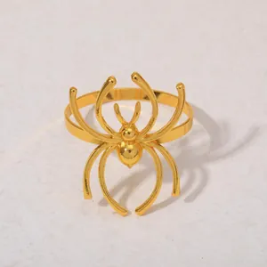 Rond de serviette élégant en forme d'araignée dorée en métal poli pour banquets d'hôtel