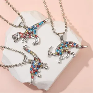 Three colorful dinosaur BFF necklaces with sparkling rhinestones on a ball chain necklace