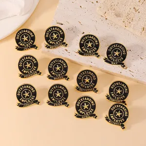 Detailed set of 12 black and gold Outstanding Employee pins for monthly recognition