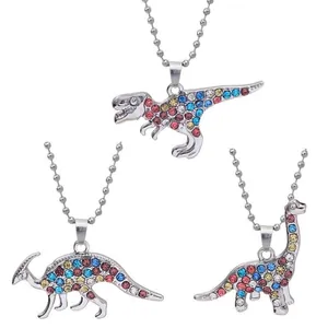 Three dinosaur-shaped silver necklaces with colorful crystals for best friends