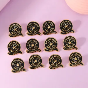 Set of 12 black and gold Outstanding Employee enamel pins with 12 months for recognition