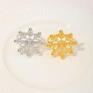 Elegant gold and silver snowflake napkin rings set for festive Christmas table decor
