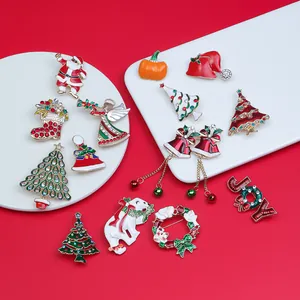 Detailed close-up of festive Christmas pins featuring Santa, angels and trees on a tray