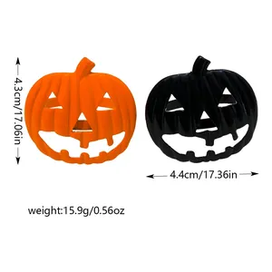 Halloween pumpkin napkin rings in orange and black for festive dining table decoration