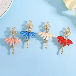 Detailed view of ballet girl brooches in pink, blue, white, and red with crystals