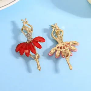 Detailed front and back views of gold ballet dancer brooches with red resin petals