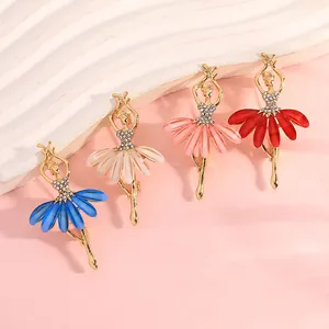 Detail of ballet dancer brooches with rhinestones and colorful petal skirts in four hues