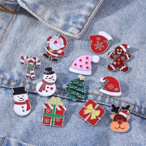 Set of 12 Christmas enamel pins featuring Santa and reindeer on denim jacket