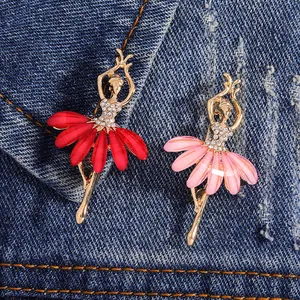 Elegant rhinestone ballet girl brooch pins in red and pink on denim background