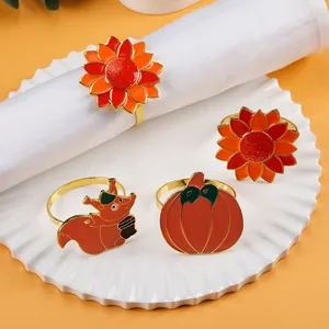 Fall napkin rings set featuring enamel sunflower, pumpkin, and squirrel motifs