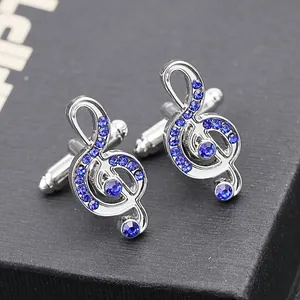 Silver music note cufflinks with blue crystals and bullet back closure for men