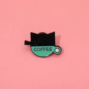 Detailed enamel pin showing a creative fusion of a black cat and a mint coffee cup