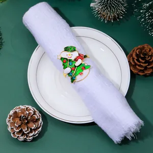 Detail of Christmas snowman and tree napkin ring with colorful enamel and jewels