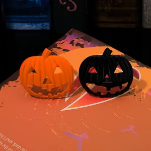 Macro detail of pumpkin napkin rings in orange and black for Halloween table decor