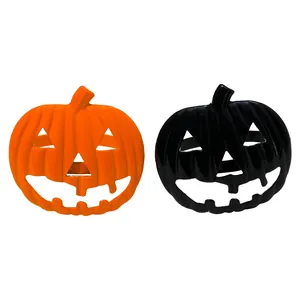 Halloween pumpkin napkin rings in orange and black enamel finish for table decor
