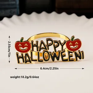Golden Happy Halloween napkin ring with red pumpkins and size specs on a white plate