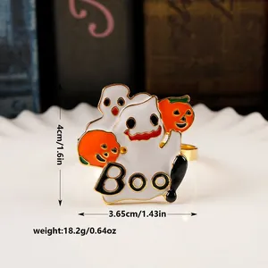 Detail showing Boo lettering and pumpkin charms on a Halloween themed napkin ring