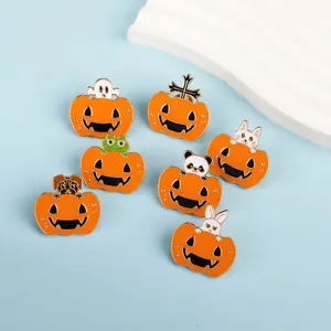 Detailed close-up of colorful Halloween enamel pins featuring pumpkin and ghost designs