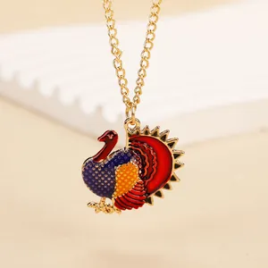 Detailed view of colorful turkey pendant with golden chain for Thanksgiving