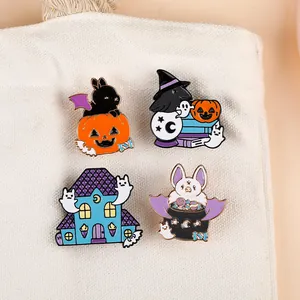 Set of four Halloween enamel pins featuring ghosts, pumpkins, and a haunted house on canvas