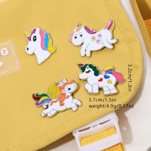 Set of four cute cartoon unicorn enamel pins and badges for clothing and bags