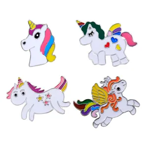 Set of four cute cartoon unicorn enamel pins with rainbow colors for clothing and bags