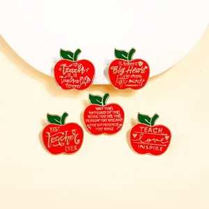 Detail of 5-piece enamel apple pins set with gold teacher appreciation quotes