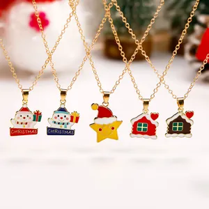 Christmas necklace set with snowman, star, and house pendants on gold chains