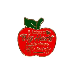 Red apple enamel brooch with golden quote It takes a Big Heart to shape little minds