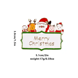 Broche de Noël en émail avec Père Noël, renne et manchot sur une bannière festive
