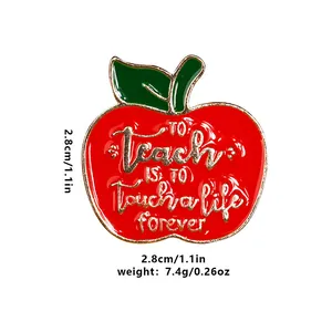 Red enamel apple brooch with gold lettering 'To Teach is to Touch a Life Forever' for teachers