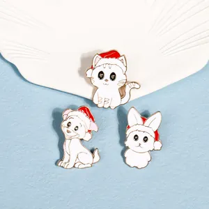 Detail showing cute enamel cat, dog, and rabbit pins wearing red festive Santa hats