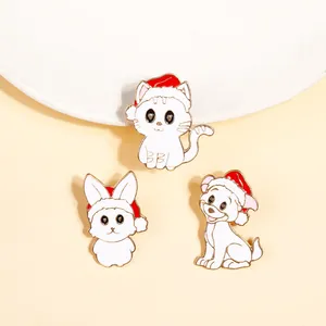 Detailed close-up of Christmas animal enamel pins featuring a cat, rabbit, and dog in red hats