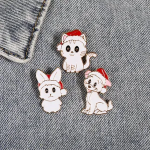 Three-piece Christmas animal brooch set featuring cats and dogs with festive red hats