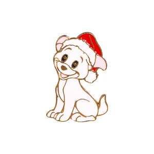 Cute white puppy enamel pin with red Christmas hat and gold trim on white background