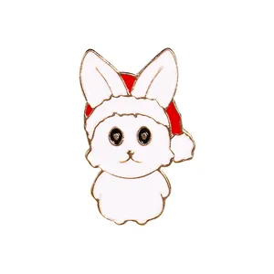 Cute cartoon white rabbit enamel pin wearing a red Santa hat for Christmas decoration
