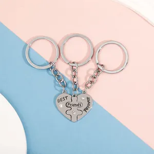 Detailed view of a three-piece heart-shaped puzzle keychain set with BEST FRIENDS FOREVER text