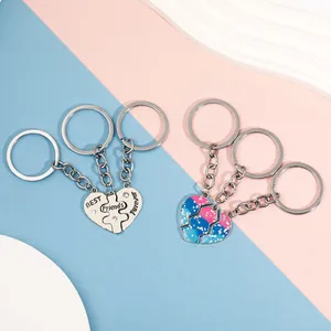 Close-up of heart puzzle keychain set with crystal stones and Best Friends Forever engraving