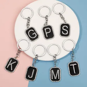 Llaveros estilo hip hop con letras de diamantes y esmalte negro en aro plateado