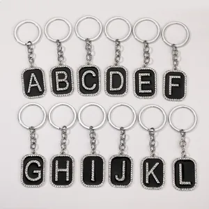 Set de llaveros de letras estilo hip hop con brillantes A-L en metal plateado fino