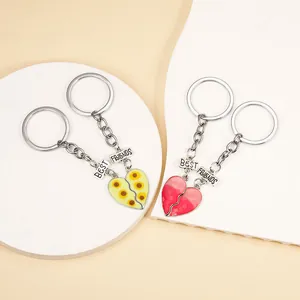 Detailansicht der Best Friends Herz-Schlüsselanhänger mit Sonnenblumen-Anhängern