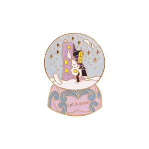 Cartoon snow globe enamel pin with castle and Let it snow text on white background