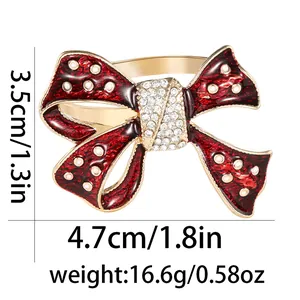 Red polka dot bow napkin ring with gold base and crystal center for wedding table decor