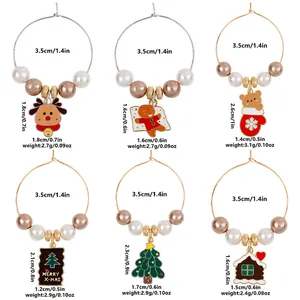 Detailed view of 6 Christmas wine glass charms with beads and festive pendants