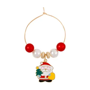 Close-up of a Christmas Santa charm wine glass ring with red and white pearls